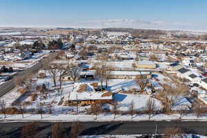 Snowy aerial view featuring a mountain view