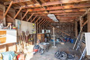 Miscellaneous room featuring lofted ceiling