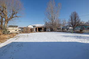 View of yard layered in snow