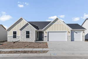 View of front of property featuring a garage