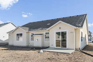 Rear view of property featuring a patio