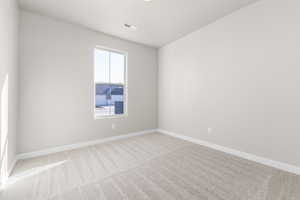 Unfurnished room with carpet floors