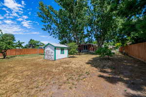 View of yard featuring a storage shed