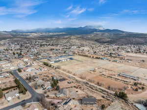 Birds eye view of property with a mountain view