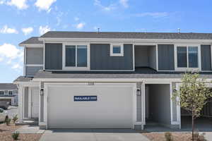 View of front of property with a garage