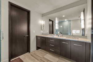 Bathroom with an enclosed shower and vanity