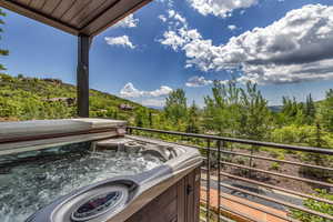 Balcony featuring a hot tub