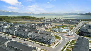 Birds eye view of property featuring a water and mountain view