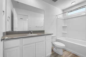 Full bathroom with shower / tub combination, vanity, toilet, and LVP floors