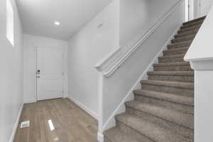 Foyer entrance featuring light laminate flooring