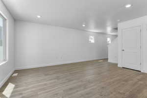 Basement with light laminate flooring