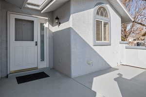 Property entrance featuring a patio