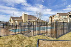 View of swimming pool featuring a lawn, a patio area, and a pergola