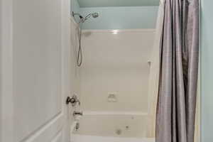 Master Bathroom featuring shower / bath combo with shower curtain