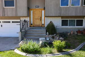 Property entrance featuring a garage