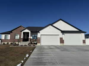 Craftsman house featuring a garage