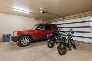 Garage featuring a garage door opener