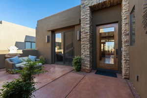 Doorway to property with a patio