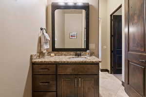 Bathroom with vanity and tile patterned floors