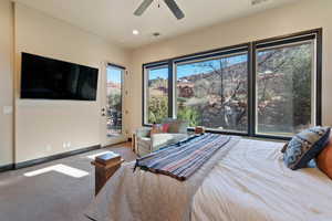 Bedroom featuring carpet, access to exterior, and ceiling fan