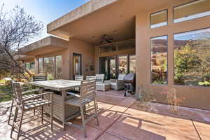 View of patio featuring outdoor lounge area and ceiling fan