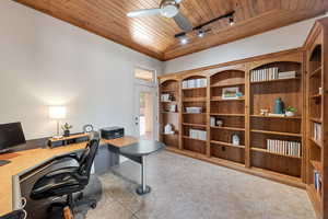 Office featuring wood ceiling, rail lighting, ceiling fan, and light tile patterned flooring