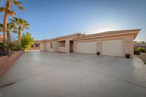 View of front of home featuring a garage and cooling unit