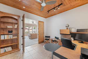 Tiled home office featuring track lighting, wooden ceiling, and ceiling fan