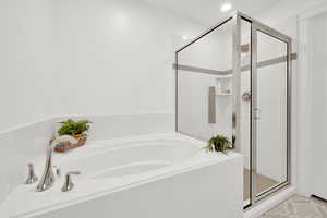 Bathroom featuring separate shower and tub