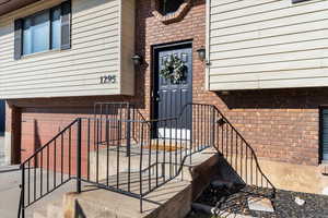 View of exterior entry featuring a garage