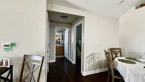 Dining space featuring dark wood-type flooring