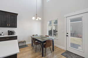 Dining space featuring a chandelier and light laminate / wood-style flooring