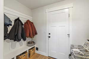 Mudroom with Laminate / wood-style flooring