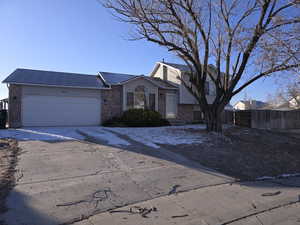 View of front of property featuring a garage