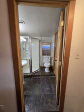 Bathroom with an enclosed shower and toilet