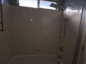 Bathroom with shower / tub combination