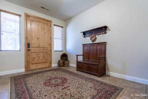 Entryway featuring light tile patterned floors