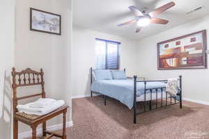 Bedroom featuring carpet and ceiling fan