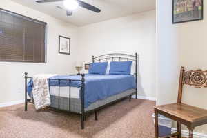 Bedroom featuring carpet flooring and ceiling fan