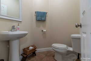 Bathroom with tile patterned flooring and toilet