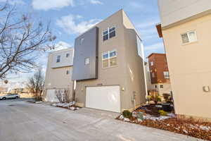 View of side of home with a garage