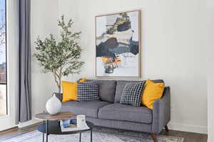 Living room featuring dark hardwood / wood-style flooring