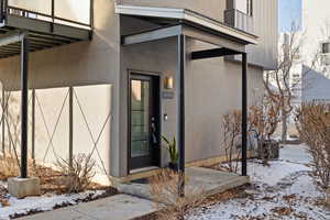 View of snow covered property entrance