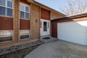 Property entrance featuring a garage