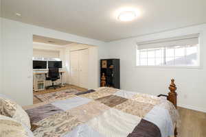 Bedroom featuring a closet and light wood-type flooring