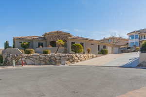 Mediterranean / spanish-style home featuring a garage