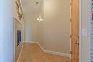 Hall with light tile patterned floors