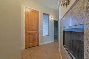 Hallway with light tile patterned floors