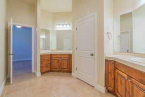 Bathroom with vanity and tile patterned flooring