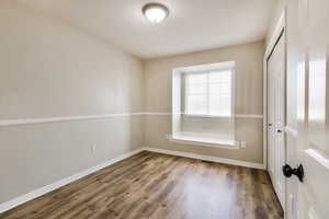 Empty room featuring hardwood / wood-style floors